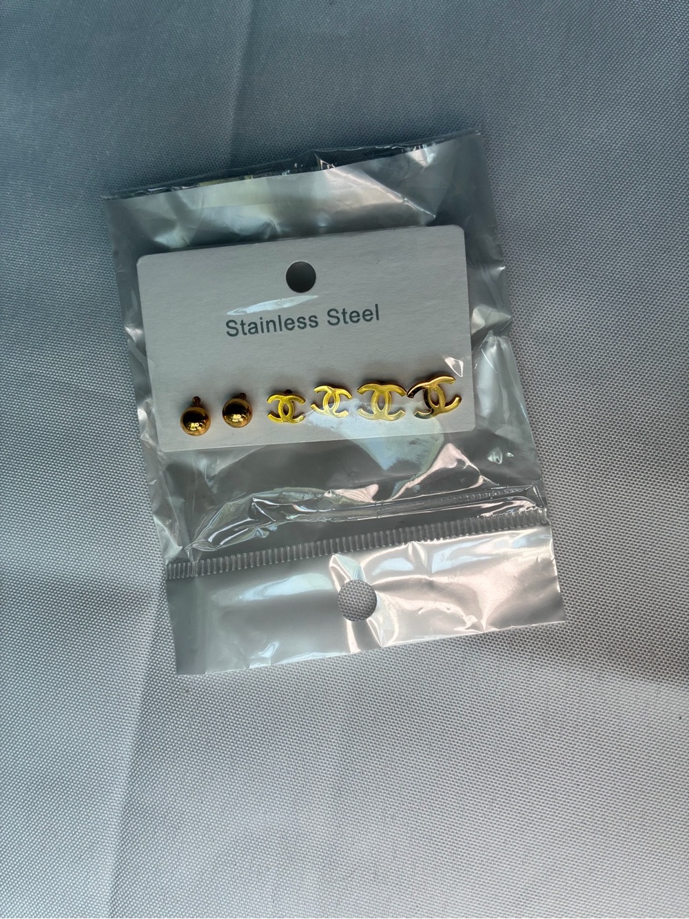Gold Tone Stainless Steel Logo Stud Earring Set - Picture 3 of 4